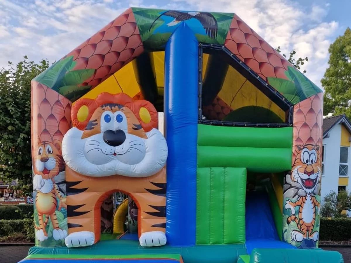Hüpfburg mit Tigermotiv, Schuppendach und Rutsche